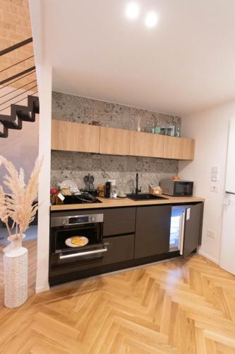 a kitchen with a stove and a counter top at Centro Storico Rooms & Suites in Manfredonia