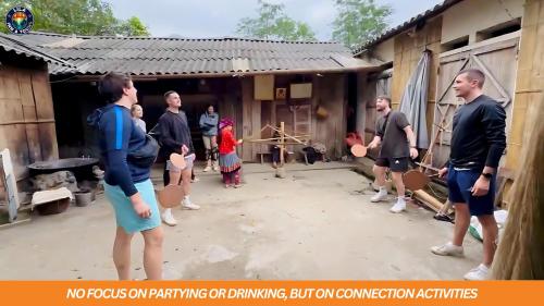 a group of people standing outside of a building at LiLa Inn & Motorbike Tours Ha Giang in Ha Giang