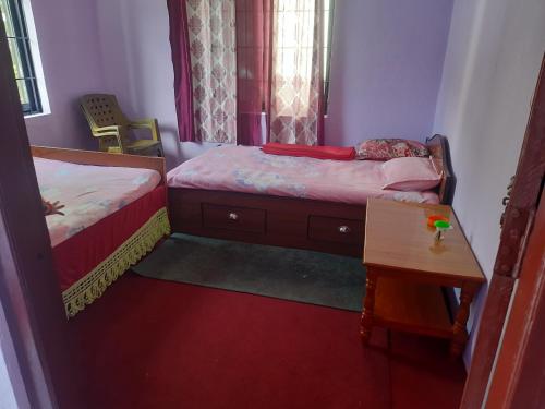 Ένα ή περισσότερα κρεβάτια σε δωμάτιο στο Manthali Community Homestay No13 Aakase
