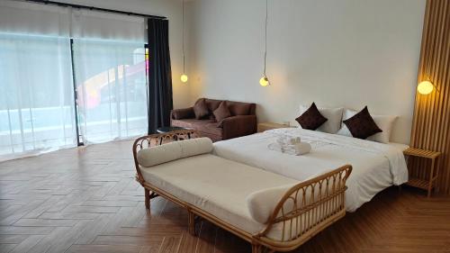 Postel nebo postele na pokoji v ubytování บ้าน ณ วนา