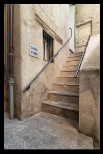 a set of stairs with a sign on the side of a building at Casa Vista Cadro Executive in Lugano