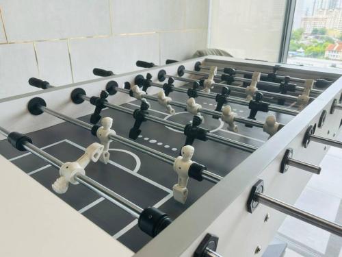 a row of counters in a room at Urban Suites Cozy Home with Netflix and Board games in Jelutong