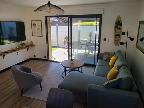 Et opholdsområde på Maison avec piscine Pyla sur mer