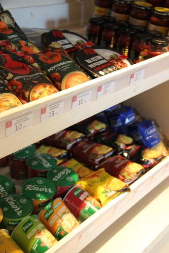 a store shelf filled with different types of food at Apartamenty Aries Residence Bukowina in Bukowina Tatrzańska
