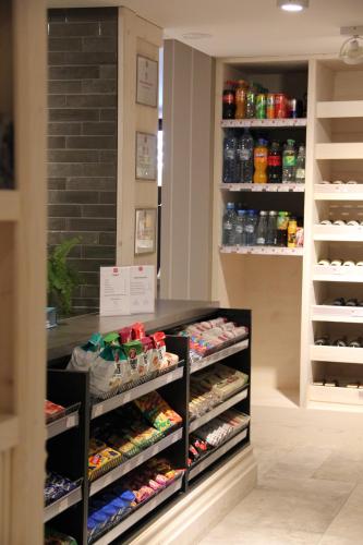 a store with a display case filled with shoes at Apartamenty Aries Residence Bukowina in Bukowina Tatrzańska