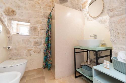 Un baño de Siede la Terra - Trullo con piscina