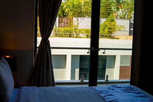 Ένα ή περισσότερα κρεβάτια σε δωμάτιο στο Africa's Touch & Leisure