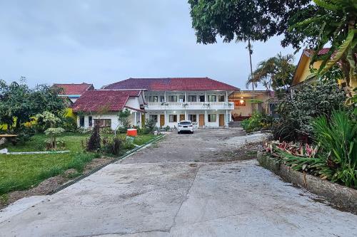 Κήπος έξω από το Urbanview Orchid Guest House