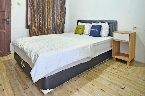 Ένα ή περισσότερα κρεβάτια σε δωμάτιο στο Urbanview Orchid Guest House