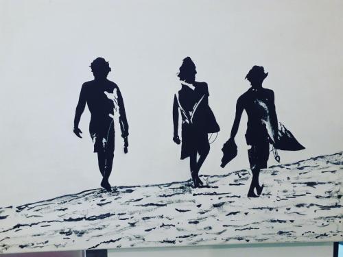 three silhouettes of three people walking on the beach at Charming dark lodge in river in Weligama