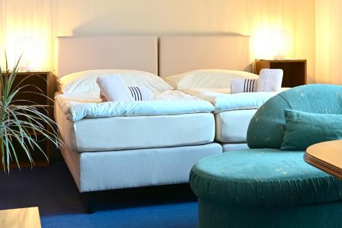 a living room with two couches and a couch at Hotel Classic in Nový Bydžov