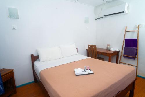 Cama o camas de una habitación en Impian Inn