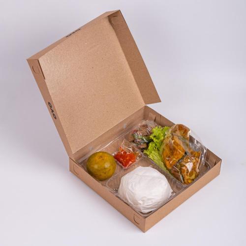 a box filled with different types of food at Hotel O Solo Point Guest House Syariah in Solo