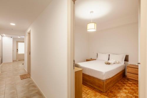 Ένα ή περισσότερα κρεβάτια σε δωμάτιο στο Rooms4you 2 in historic center of Braga