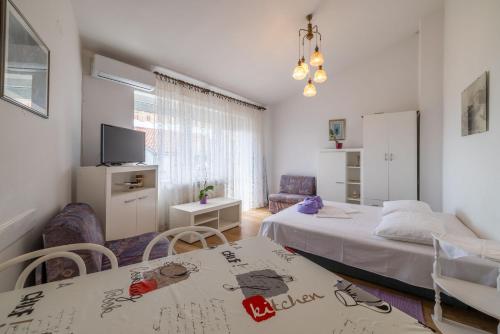 Ένα ή περισσότερα κρεβάτια σε δωμάτιο στο Apartments FEDA