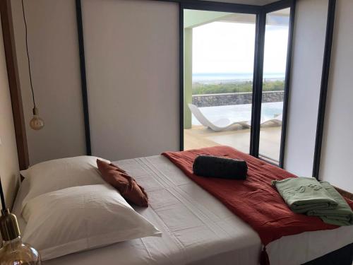 Postel nebo postele na pokoji v ubytování Villa spacieuse avec piscine à Saint-Pierre