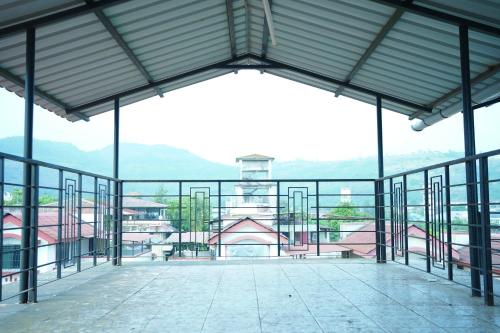 a view from the inside of a building at SWARAGAN HOLIDAYS VILLA 4 BHK AC LUXURY Room private pool in Lonavala