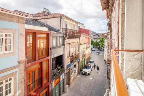 a view of a city street from a balcony at Rooms4you 1 in historic center of Braga in Braga