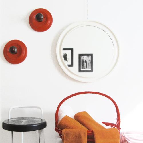 a room with a mirror and a chair and a stool at Art Design Duomo Suites in Milan