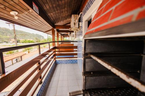 a train is coming down the stairs of a building at Tayá Hospedagens in Ubatuba