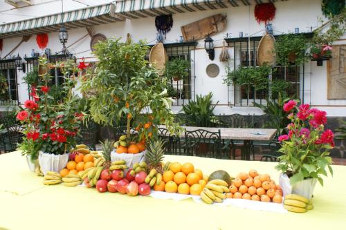 a display of fruits and vegetables on a table at Hotel Juan Francisco in Güéjar-Sierra