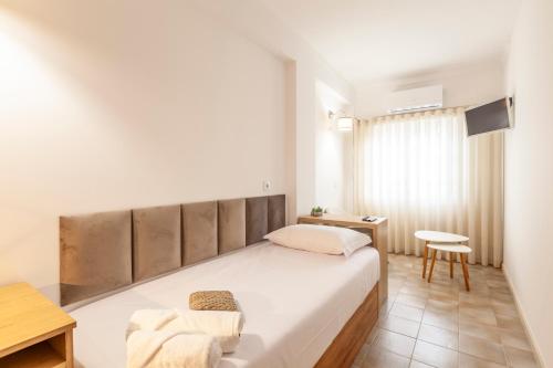 a bedroom with a large bed and a desk at Rooms4you 1 in historic center of Braga in Braga