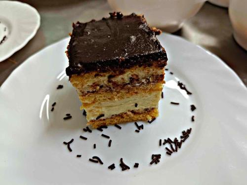 a piece of chocolate cake on a white plate at Átrium Hotel Harkány in Harkány