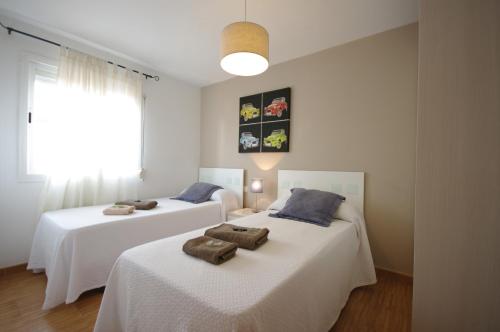 Postel nebo postele na pokoji v ubytování Livingtarifa Apartamento Los Lances