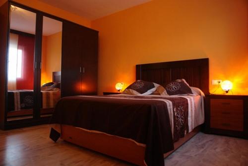 Posteľ alebo postele v izbe v ubytovaní Livingtarifa Apartamento Simba