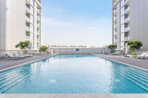 a swimming pool in the middle of a building at STAY BY LATINEM Luxury 2BR Holiday Home CV A813 near Burj Khalifa in Dubai