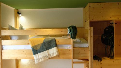a wooden bunk bed in a room at Villa Lydia in Kurort Altenberg