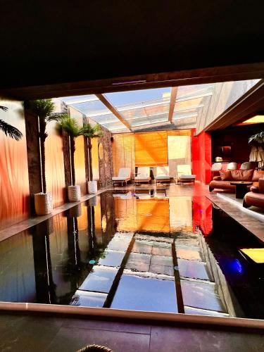 a view of a room with a pool of water at Motel Villa Princi in Kosovo Polje