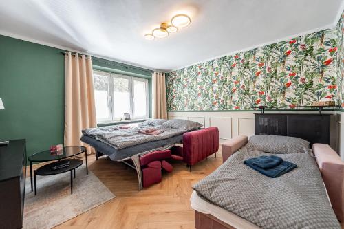 a living room with two beds and a couch at Luxusný apartmán pri nemocnici in Košice