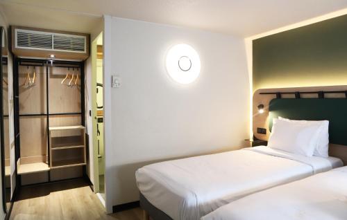 Letto o letti in una camera di Campanile Toulouse Balma - Cité de l'Espace