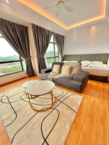 a living room with a couch and a table at imperium residence kuantan in Kuantan