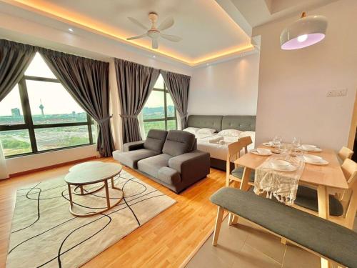 a living room with a couch and a table at imperium residence kuantan in Kuantan
