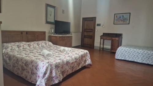 Ένα ή περισσότερα κρεβάτια σε δωμάτιο στο Residence Le Due Torri