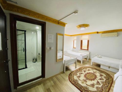 a bathroom with a walk in shower and a glass door at Stylish Hotel Old City in Istanbul