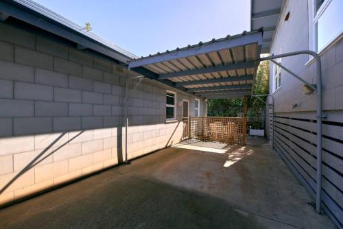 a patio with awning on the side of a building at Inlet Shack - 300 meters to the beach in Aireys Inlet