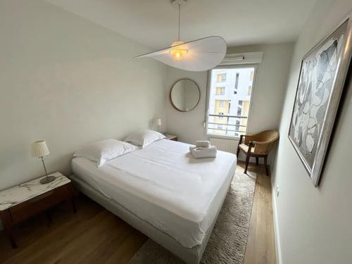 Posteľ alebo postele v izbe v ubytovaní Appartement avec balcon