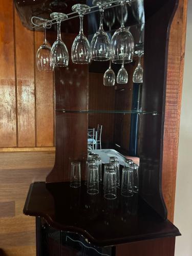 a group of wine glasses sitting on a counter at Cabañas Mahatua in Hanga Roa