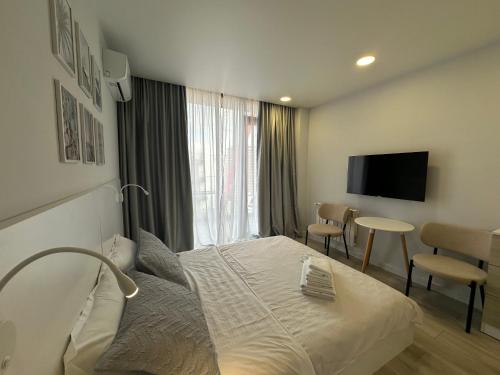 Boutique Seaside Livingにあるテレビまたはエンターテインメントセンター