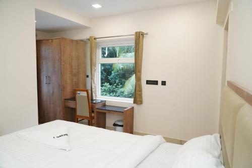 Postel nebo postele na pokoji v ubytování Hotel Jai's Inn