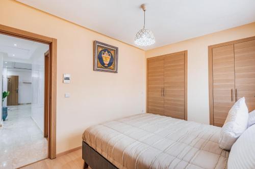 Postel nebo postele na pokoji v ubytování Migdal Gueliz Apart Hôtel