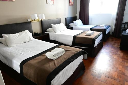 Cama o camas de una habitación en Hotel Mendoza
