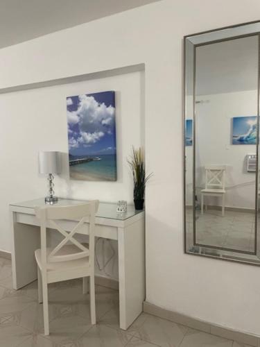 a white desk with a chair and a mirror at Montecielo-Mountain View Escape 20 minutes to Airport in Canovanas