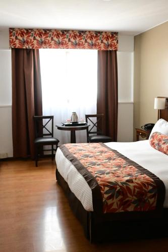 Cama o camas de una habitación en Hotel Mendoza