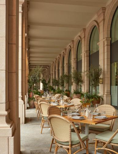 a row of tables and chairs on a patio at Miiro Borneta in Barcelona