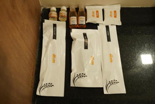 a group of bottles of hot sauce in white bags at Hotel Jai's Inn in Thanjāvūr