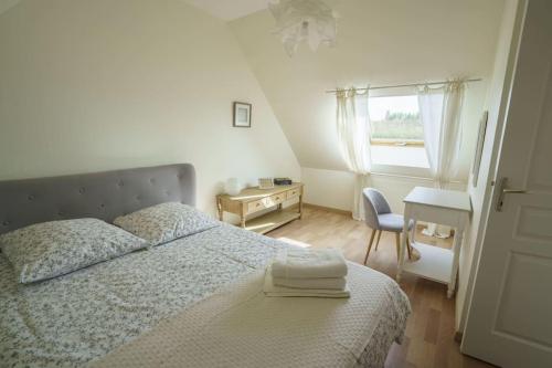 Postel nebo postele na pokoji v ubytování La Maison des Vergers